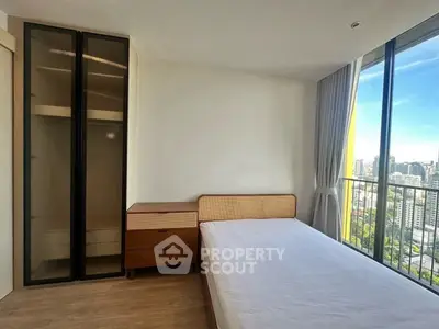 Bright bedroom with city view and modern furniture