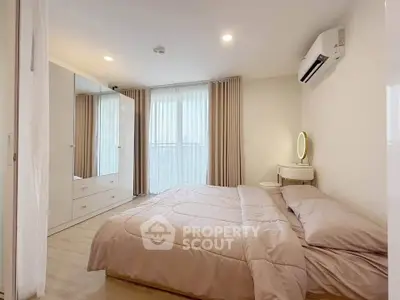 Spacious modern bedroom with elegant decor and natural light