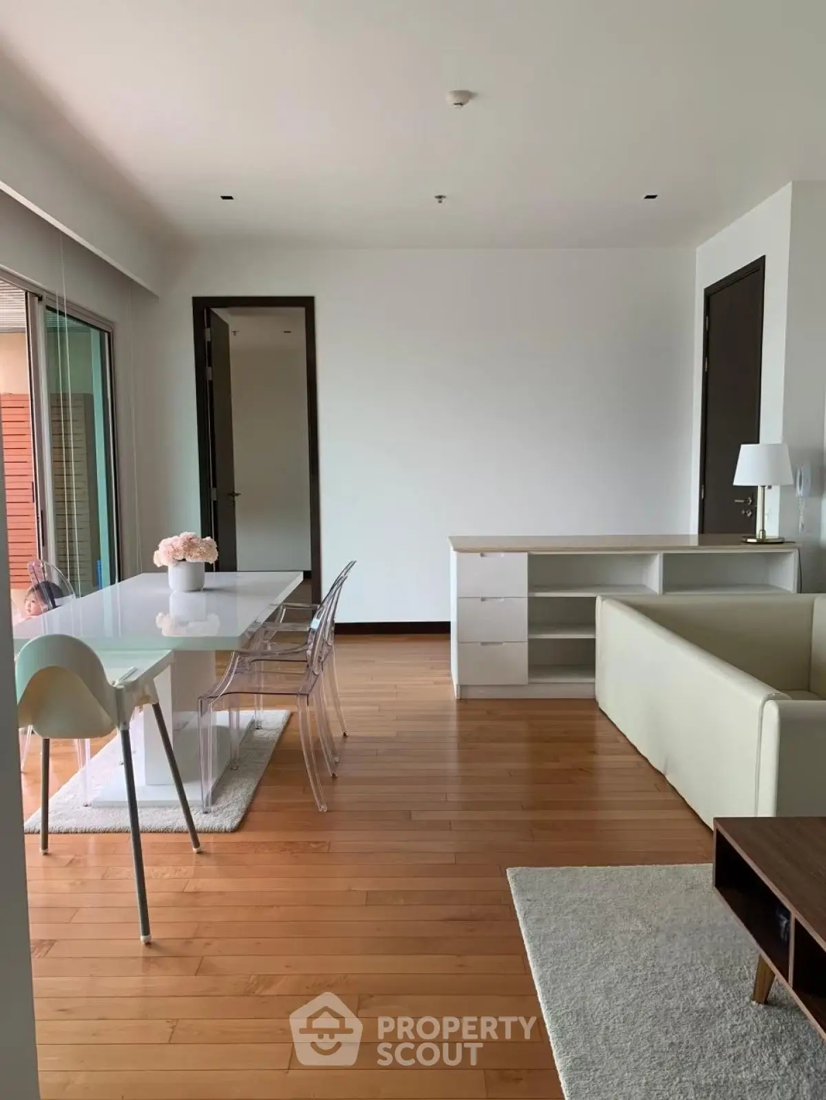 Modern living room with wooden flooring and stylish furniture