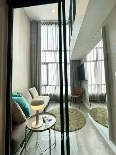 Modern living room with high ceilings and stylish decor