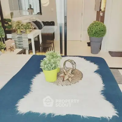 Stylish modern living room with chic decor and vibrant plants enhancing the cozy ambiance.