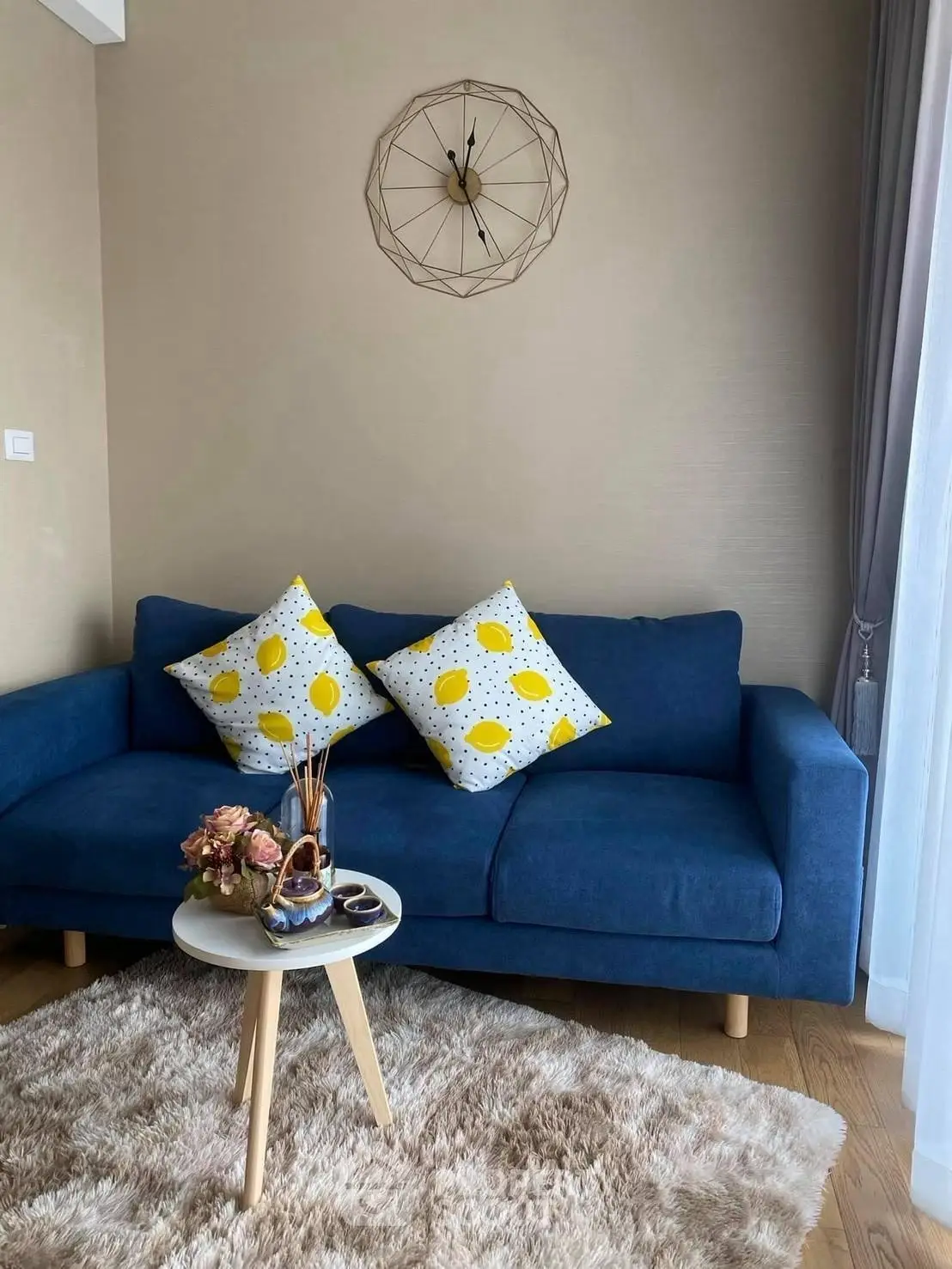 Chic living room with blue sofa and stylish decor