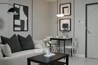 Modern living room with stylish decor and cozy dining area, perfect for urban living.