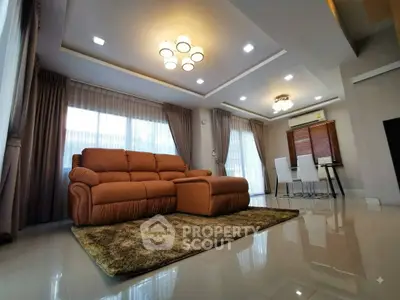 Spacious modern living room with elegant lighting and plush sofa in a luxurious home.