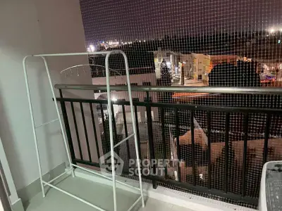 Cozy balcony with city view, perfect for relaxing evenings.