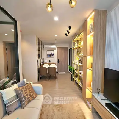 Modern living room with stylish decor and open dining area