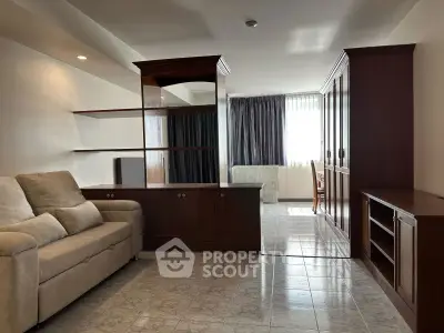 Spacious living room with elegant wooden furniture and natural light