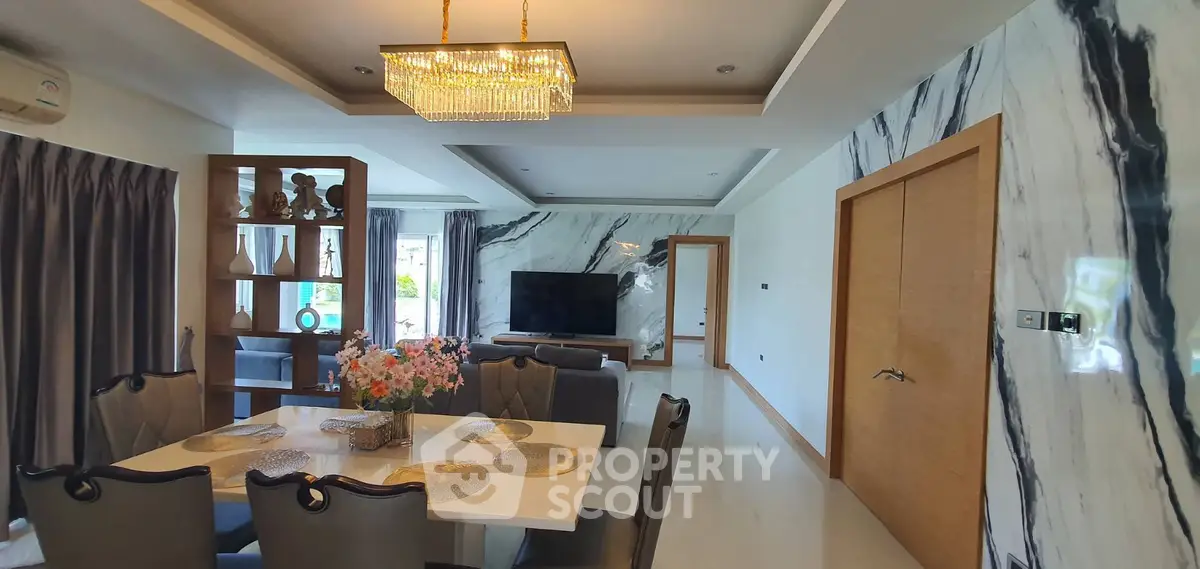 Luxurious living room with elegant dining area and modern decor