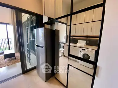 Modern apartment kitchen with sleek appliances and open layout