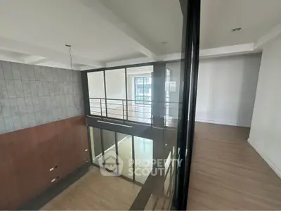 Spacious modern loft with high ceilings and large windows for natural light.