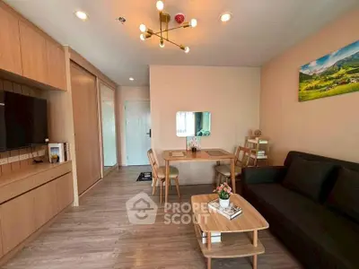 Modern living room with stylish furniture and elegant lighting in a cozy apartment.