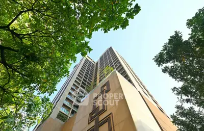 Stunning high-rise building with lush greenery and modern architecture.