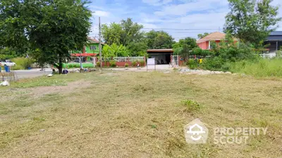 Spacious residential land plot with lush greenery and potential for development