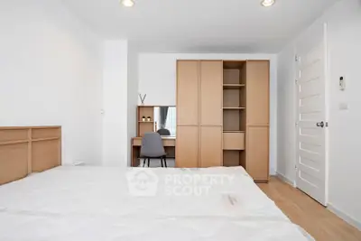 Modern bedroom with wooden furniture and minimalist design