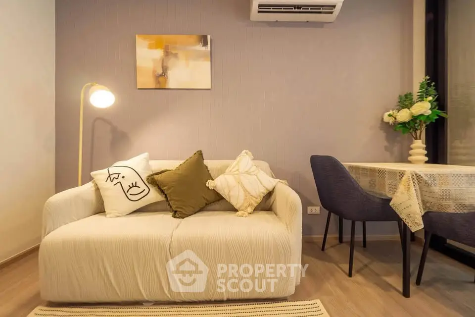Cozy living room with modern decor and dining area, perfect for relaxation and entertaining.