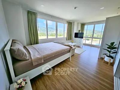 Spacious bedroom with stunning mountain views and modern decor