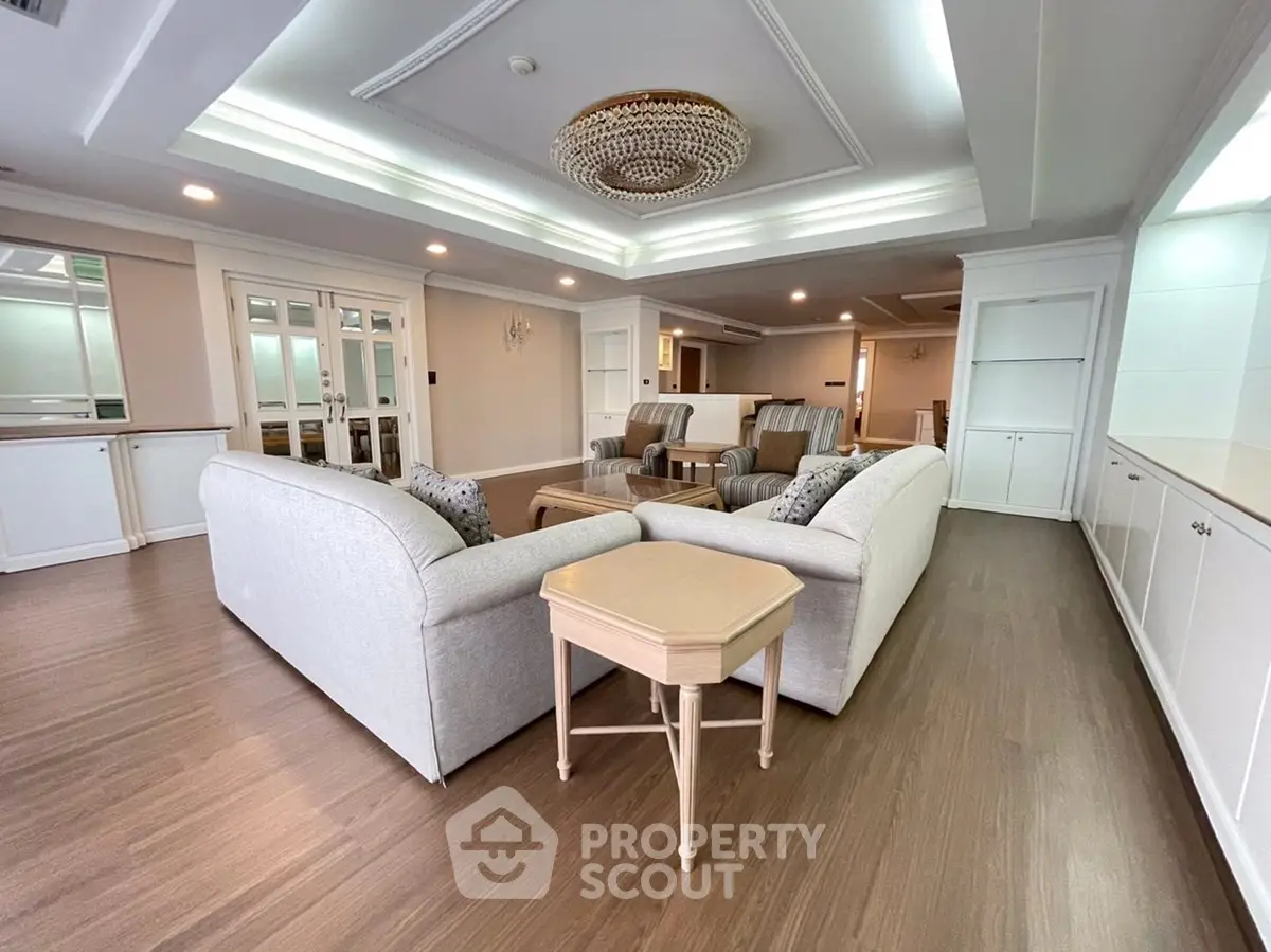 Spacious living room with elegant ceiling design and cozy seating area