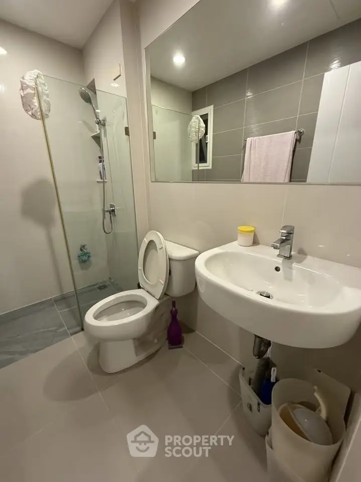 Modern bathroom with glass shower and sleek fixtures