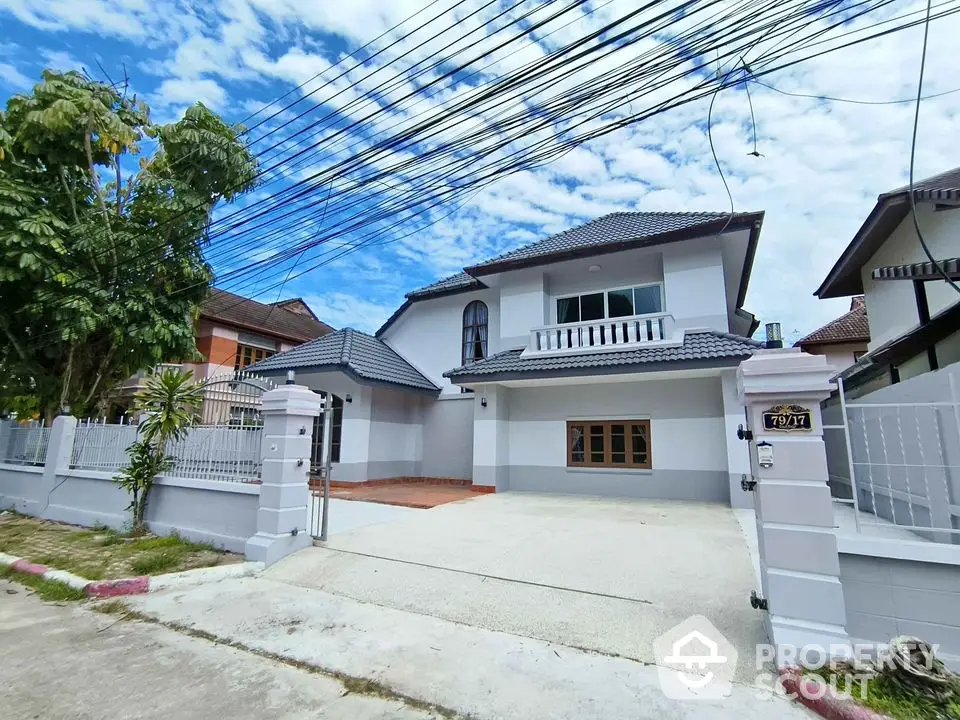 Charming two-story house with spacious driveway and modern design in a serene neighborhood.