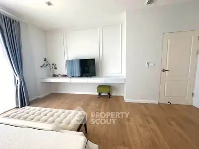 Spacious modern living room with wooden flooring and stylish decor