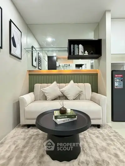 Stylish living room with modern decor and cozy seating area, perfect for relaxation.