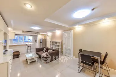 Spacious open-plan living room with modern furniture and bright lighting