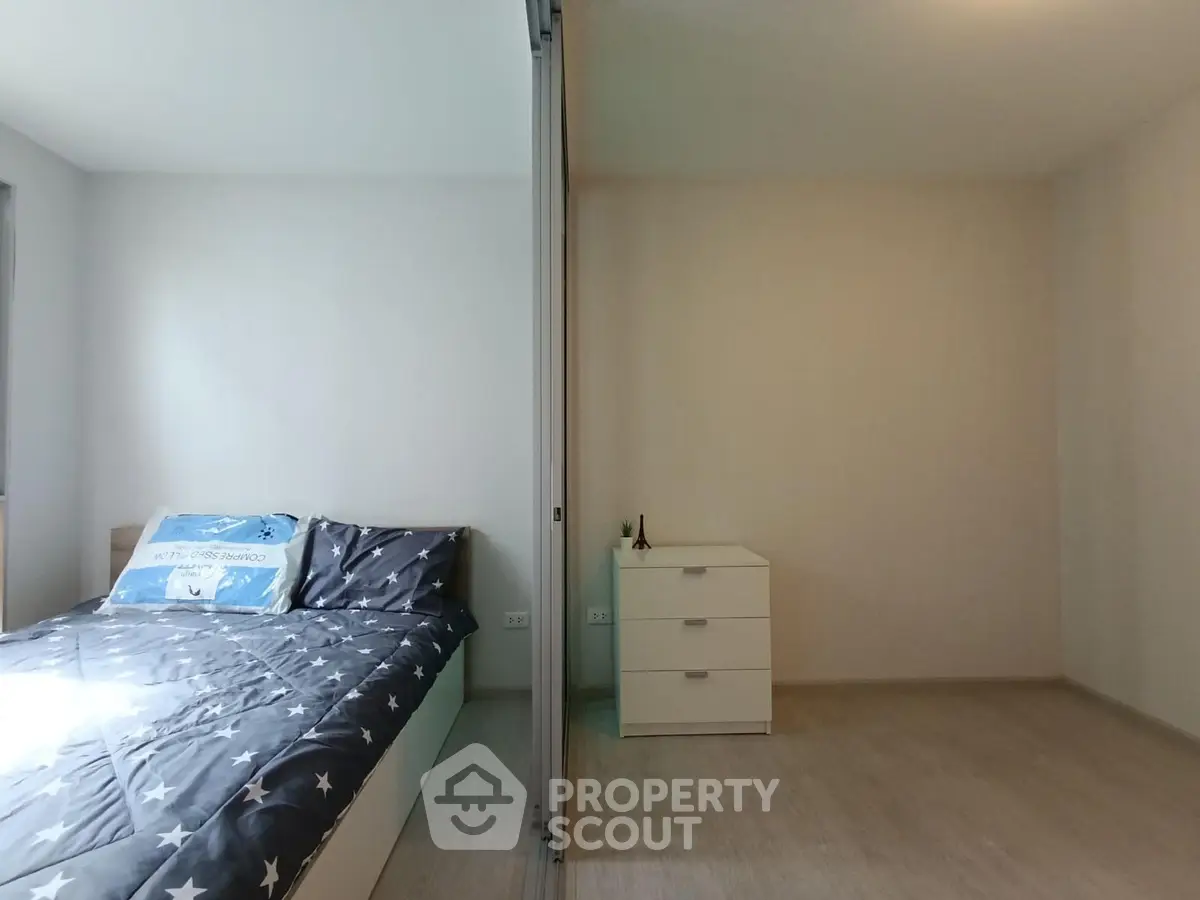 Spacious bedroom with modern decor and ample natural light