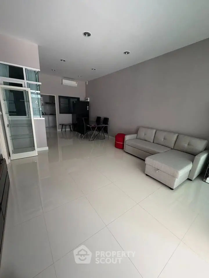Spacious modern living room with sleek furniture and open layout