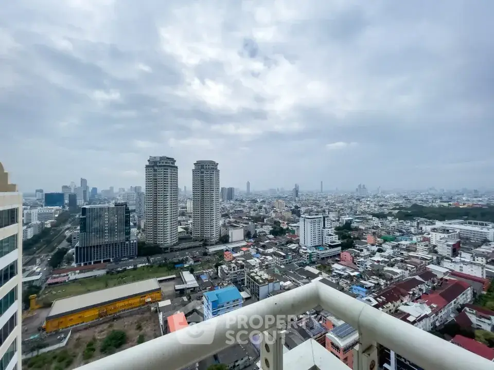 Stunning cityscape view from high-rise balcony with expansive skyline.