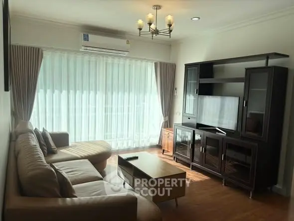 Cozy living room with modern furniture and large window for natural light