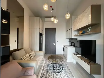 Modern living room with stylish furniture and open kitchen layout