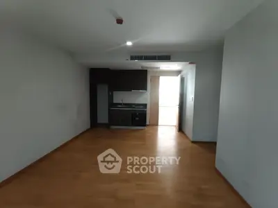 Spacious apartment with open kitchen layout and wooden flooring
