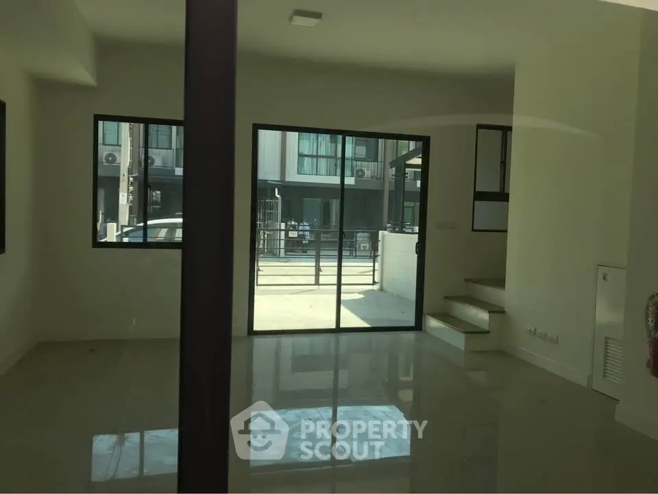 Spacious modern interior with large windows and sleek design