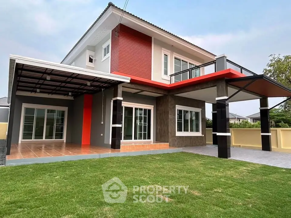Modern two-story house with spacious lawn and stylish exterior design.
