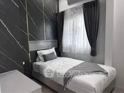 Modern bedroom with sleek design and natural light