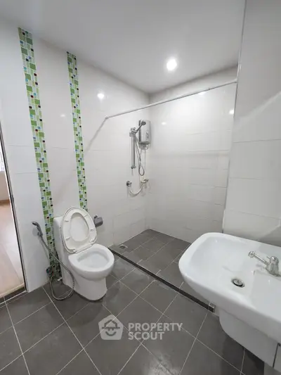 Modern bathroom with sleek tiles and contemporary fixtures