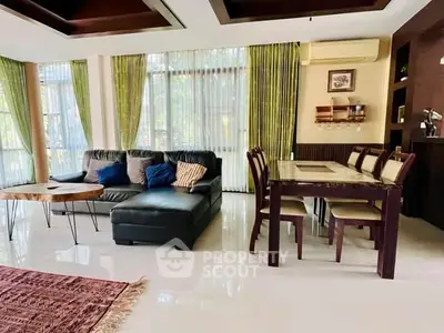 Spacious living room with elegant dining area and modern decor