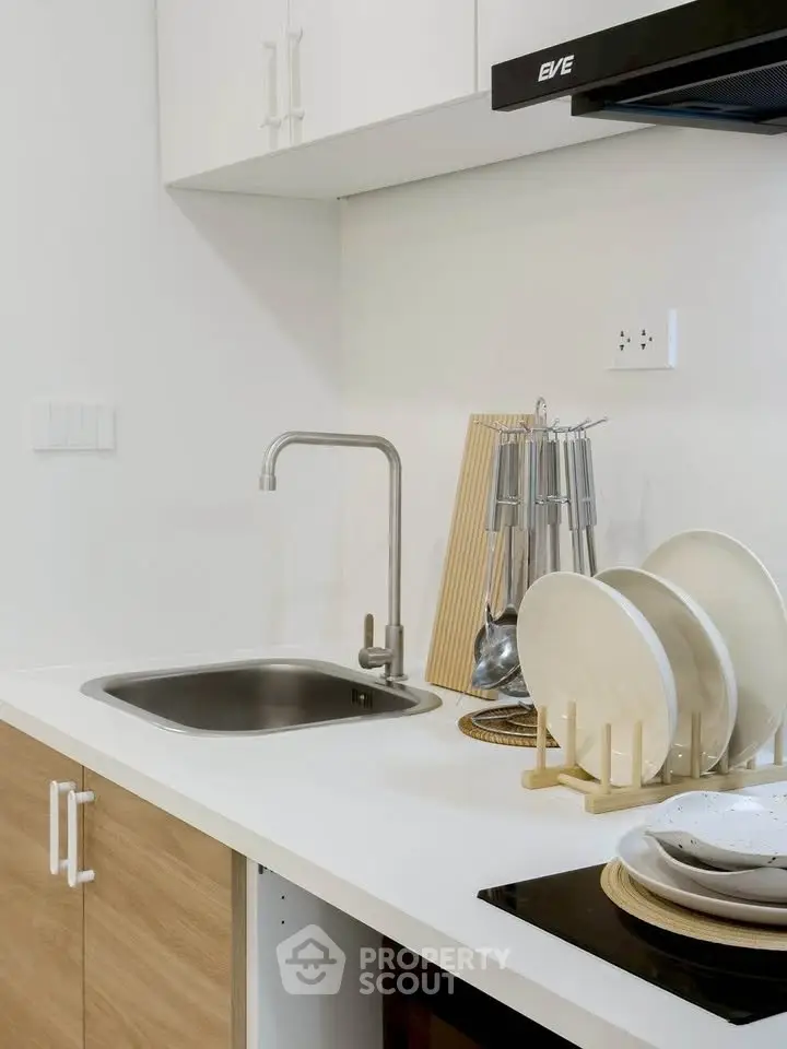 Modern kitchen with sleek design and stainless steel sink