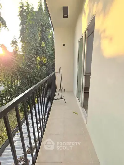 Spacious balcony with serene view and modern railing design