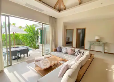 Luxurious living room with pool view and modern decor in tropical villa