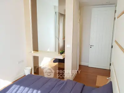 Bright and cozy bedroom with modern design and wooden flooring