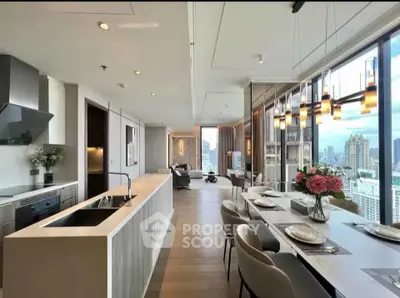 Luxurious open-plan kitchen and dining area with stunning city views and modern decor.