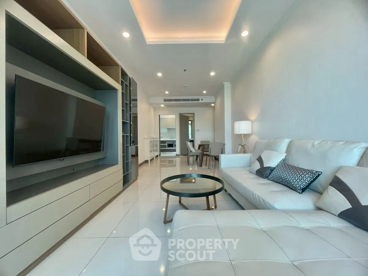 Spacious modern living room with sleek furniture and open layout, perfect for contemporary living.