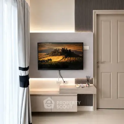 Modern living room with wall-mounted TV and elegant decor
