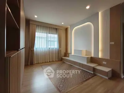 Modern living room with elegant lighting and wooden flooring