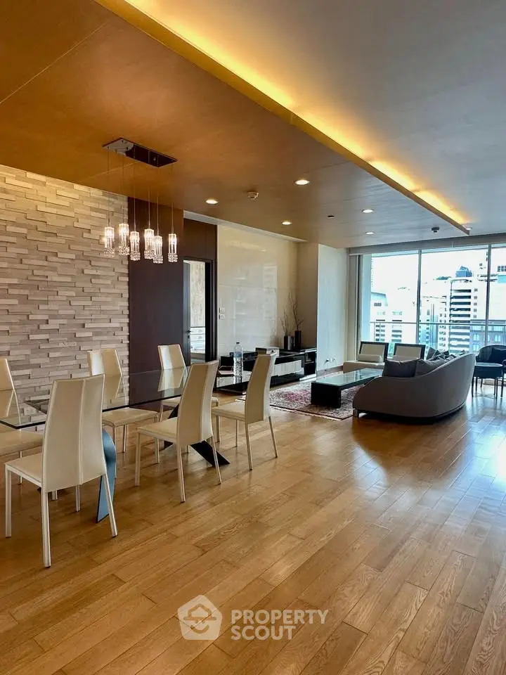 Spacious modern living room with elegant dining area and city view, featuring wooden flooring and stylish lighting.