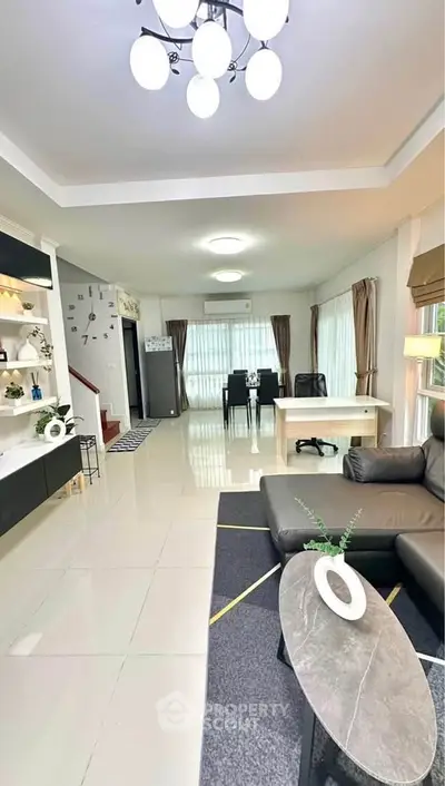 Spacious modern living room with elegant decor and ample natural light