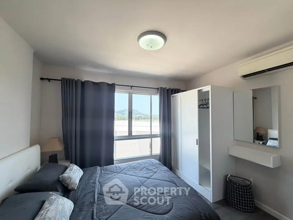 Modern bedroom with stylish decor and natural light