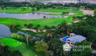 Luxurious golf course view with private pool and lush greenery