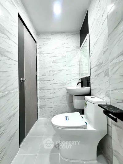 Modern bathroom with sleek design and marble tiles